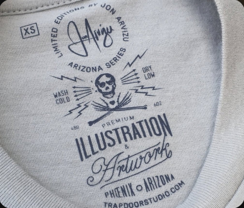 Custom tagless neck label printed inside a tee: limited-edition artwork, size, care instructions and brand, printed at Superluxe