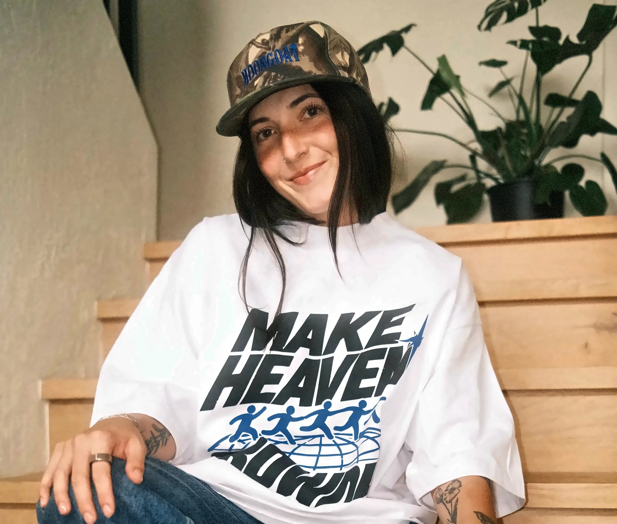 Young woman in a custom Make Heaven Crowded church tee printed by Superluxe Merch