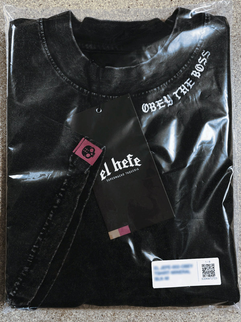 Bagged tee with a retail SKU label