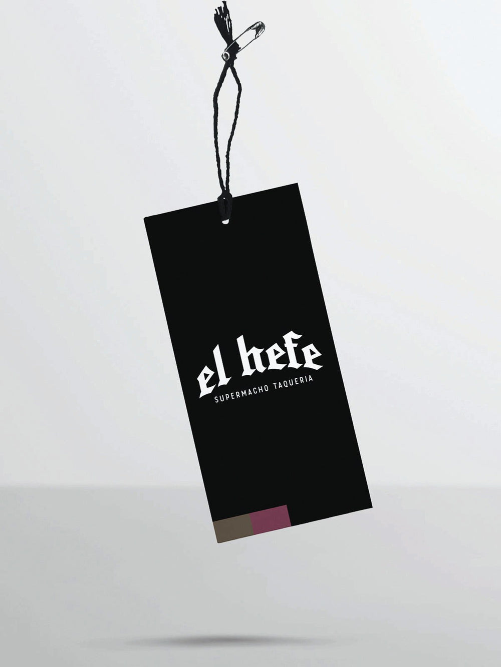 El Hefe custom hang tag on a garment