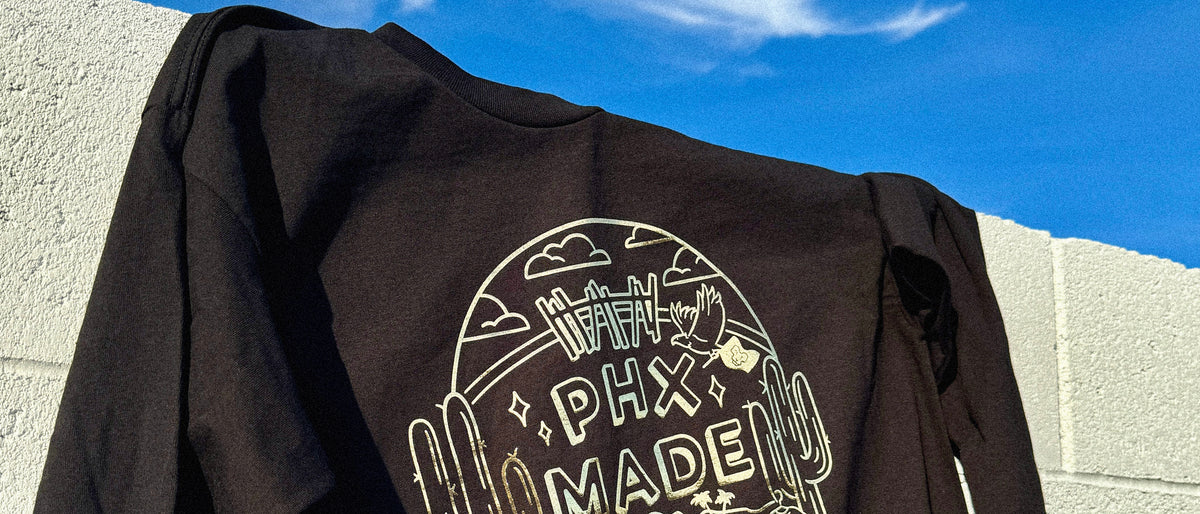 Metallic foil print on a dark garment