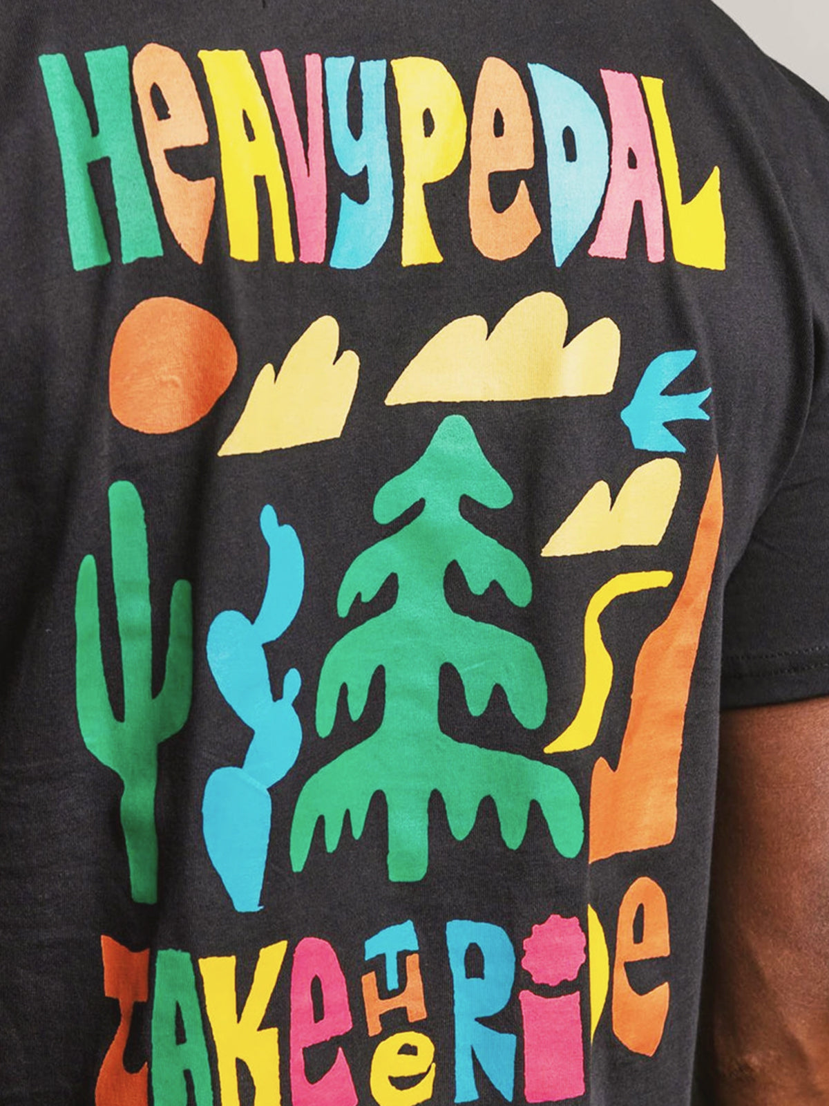 Bright multi-color high-opacity water-based print on a black tee