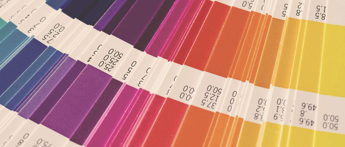 Pantone color guide fanned out for ink matching