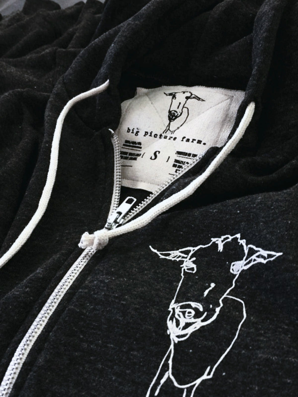 Screen printed canvas tag sewn onto a garment