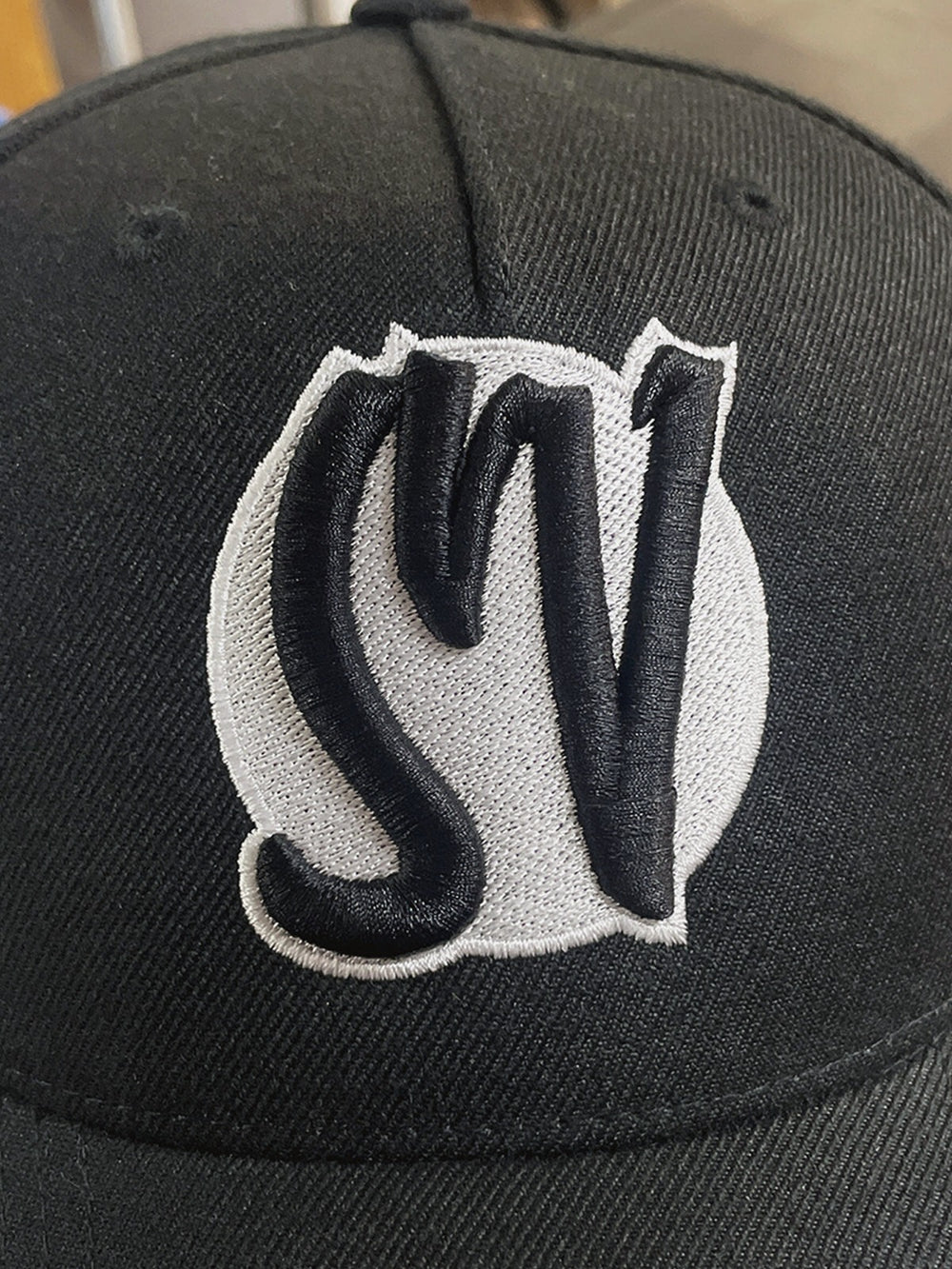 Hat combining flat and puff embroidery