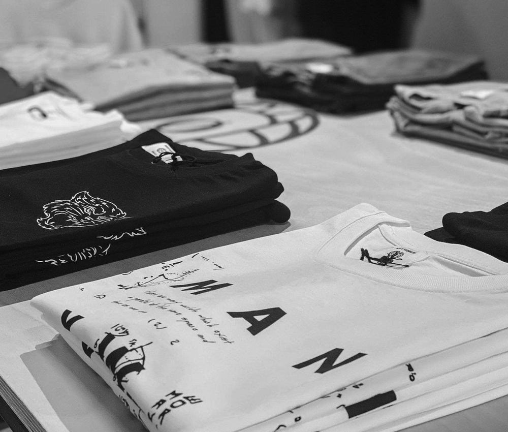 Stacks of folded custom printed tees