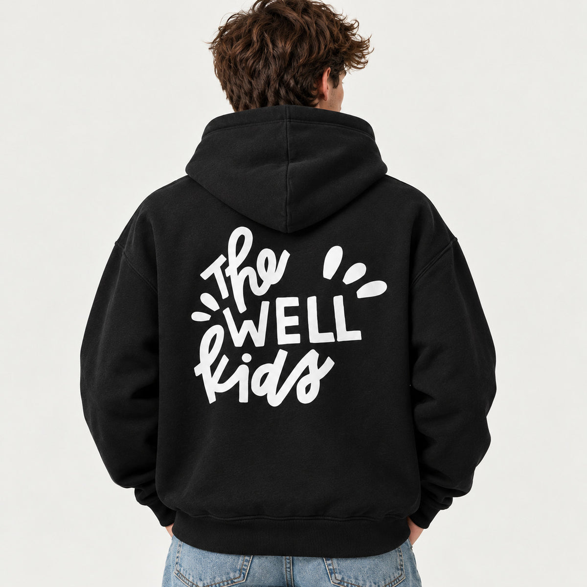 Back of a black hoodie with a white "The WELL kids" print, made by Superluxe Merch