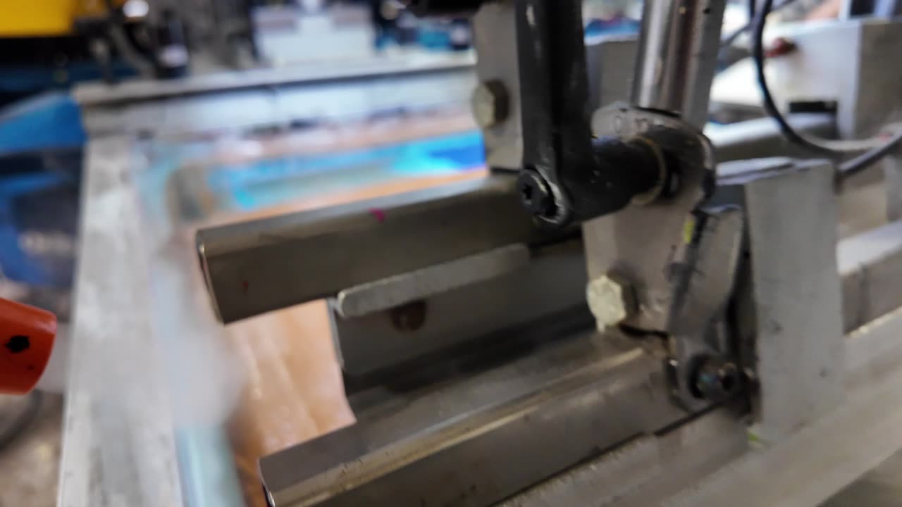 Screen printing press running in the Superluxe Merch shop in Phoenix, AZ